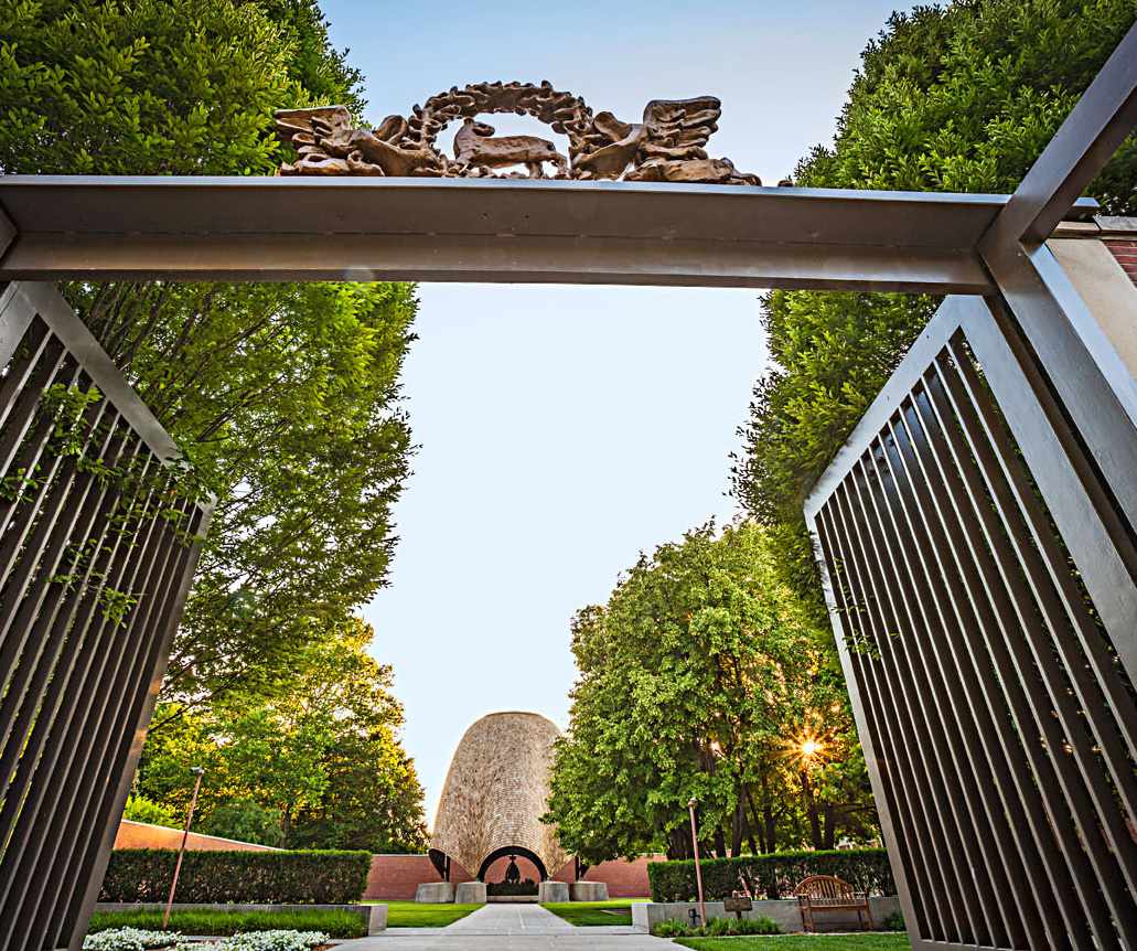 Impressive gates lead to the Roofless Church, designed to cocoon visitors.