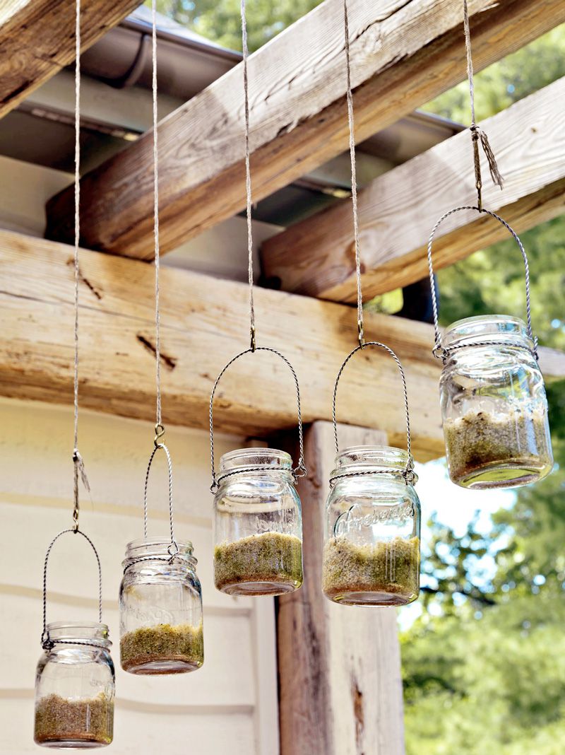 Mason jar lights above outdoor dining area