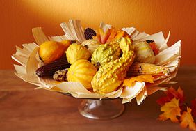 Fall centerpiece with gourds and corn husks