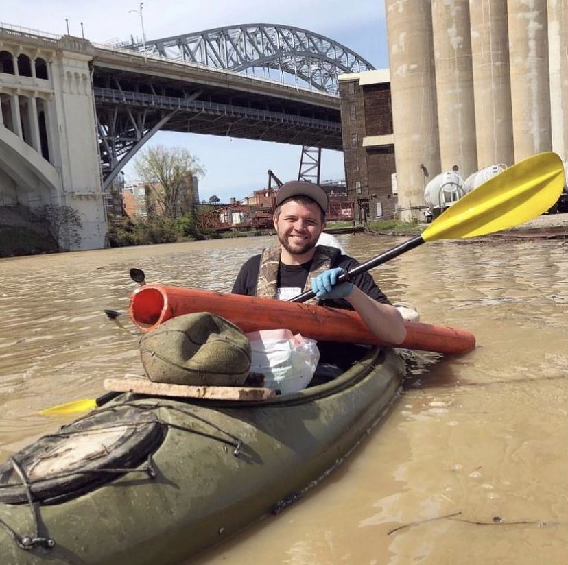 TrashFish man in kayak doing river cleanup in Ohio