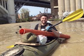 TrashFish man in kayak doing river cleanup in Ohio