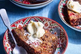 Christmas Pudding slices in bowls with butter