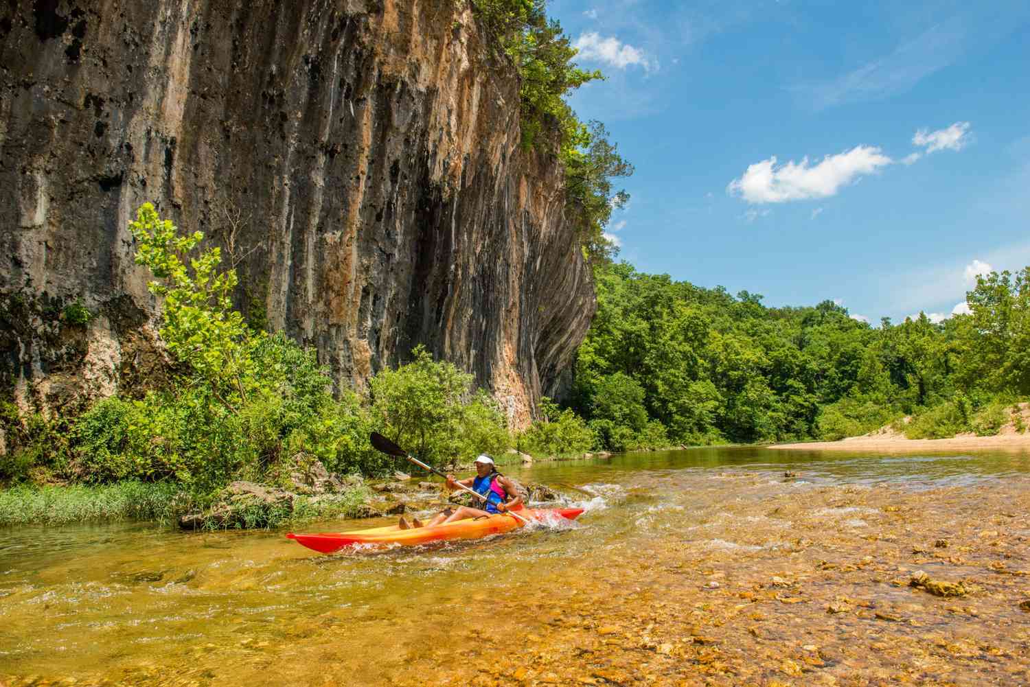 Kayaker along bluff at Echo Bluffs State Park Missouri