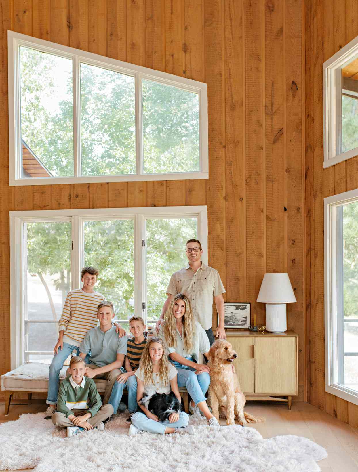 family portrait in vaulted ceiling living room