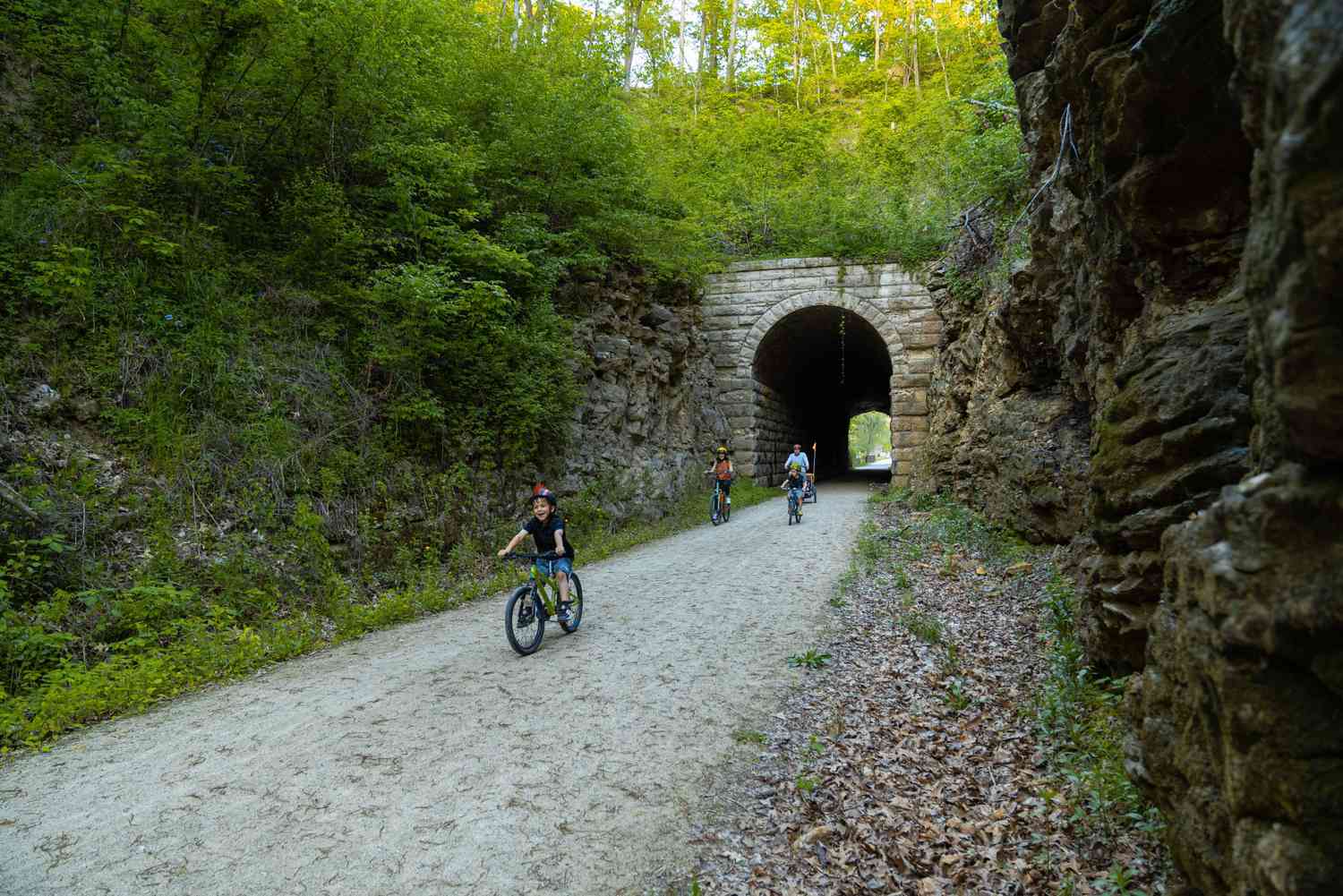 Young boy and family pedaling Katy Trail at Katy Trail State Park in Missouri