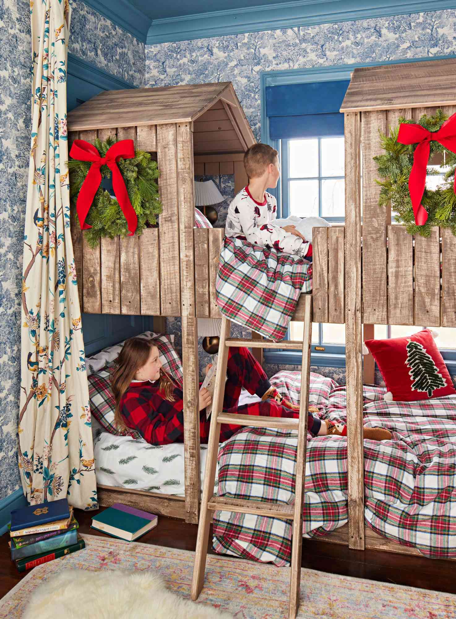 Children in bunk beds decorated for the holidays