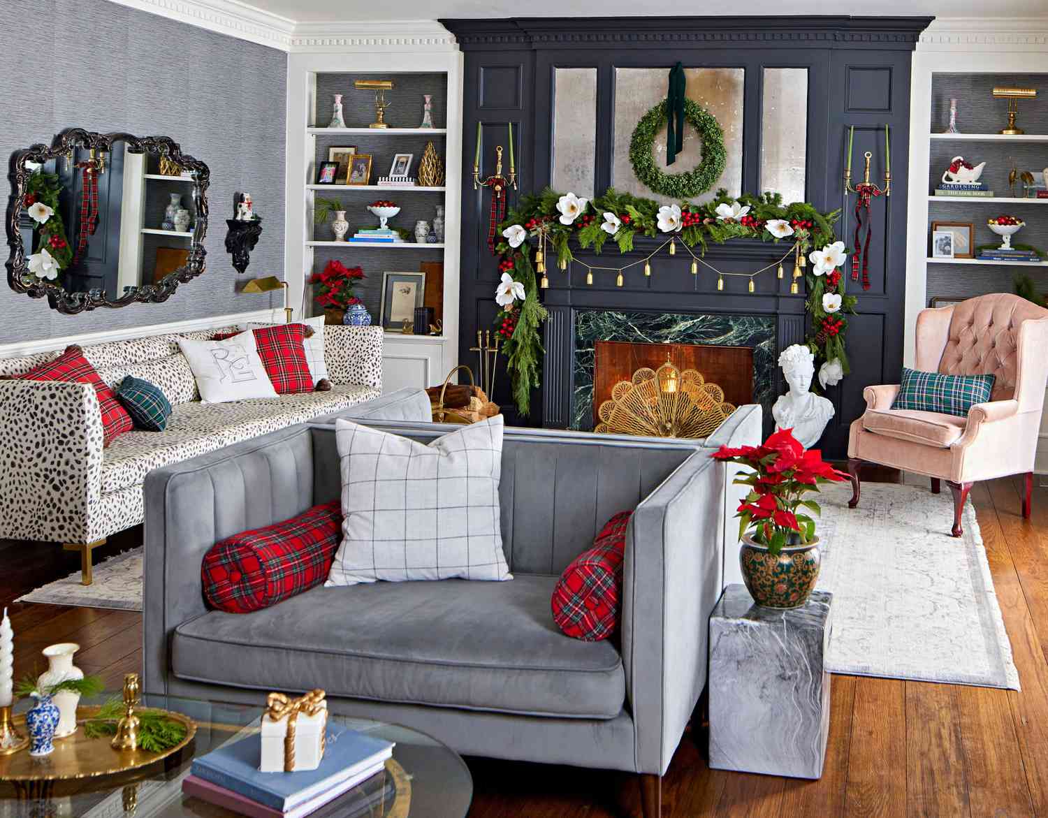 Living room decorated for Christmas with garlands and wreaths