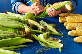 shucking ears of corn